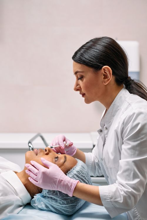 A healthcare professional speaking with a patient in a clinic
